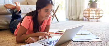 Female student studying on laptop