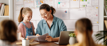 Teacher mentoring a young girl