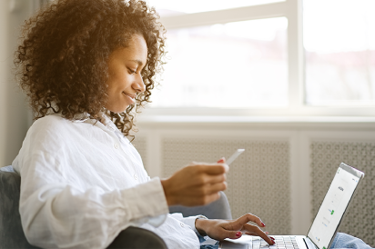 woman smiling at laptop