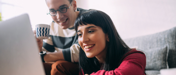 Couple looking at laptop